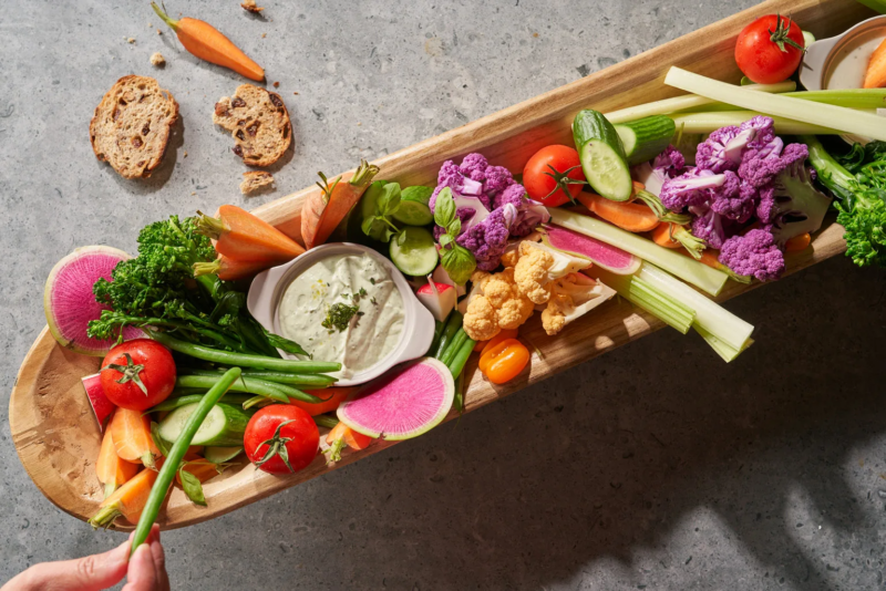 Colorful vegetable platter with dip